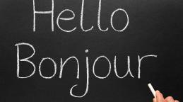 Bonjour, hello in French written on a blackboard © Sharpshot| Adobe Stock